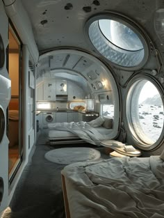 the interior of a space ship with round windows and beds on each side, looking into another room