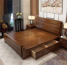 a bed with drawers underneath it in a bedroom