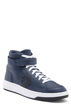 Classic logo hits bring a heritage twist to a basketball-inspired high-top fitted with a padded collar and soft foam cushioning for on or off court play. Lace-up style, hook-and-loop vamp strap Synthetic upper/textile lining/synthetic sole Imported Classic Logo, Navy White, Up Styles, Mens Shoes Sneakers, High Top, Navy And White, Nordstrom Rack, High Tops, Men's Shoes