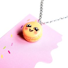 This necklace features a handmade kawaii french macaron charm sculpted from polymer clay. The macaron charm measures 1.5 cm in diameter and is securely attached to a silver tone chain necklace that measures 24 inches in length. French Macaron, Hand Necklace, French Macarons, Food Jewelry, Securely Attached, Macarons, Polymer Clay, Silver Tone, Chain Necklace