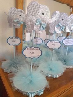 baby shower centerpieces are displayed on a table