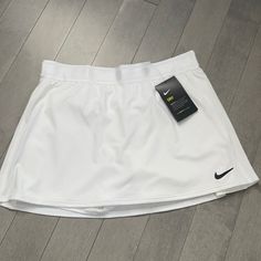 White Nike Tennis Skirt Never Worn Tags Still Attached Shorts Under Purchased At Dickssportinggoods Short Sports Skirt, White Sports Skirt For Summer, White Sport Skirt For Summer, White Athleisure Short Skirt, White Short Athleisure Skirt, White Sporty Skirt, Spring Sports Short Skirt, Sporty Skirt For Sports, Short Sports Skirt For Spring