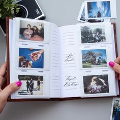 a person holding an open book with pictures on it and photos in the pages next to them