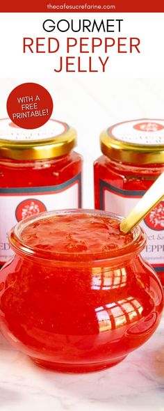 red pepper jelly in a jar with a spoon on the side and two jars next to it