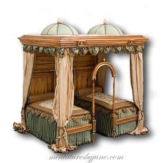 an ornate bed with canopy and curtains on it's headboard, made out of wood