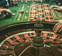 people playing roulejack at a casino table with the words casino search on it