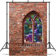 a brick wall with a stained glass window