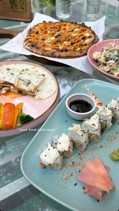 there are many different types of sushi on this blue plate, including broccoli and cauliflower