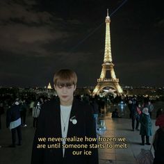 a woman standing in front of the eiffel tower at night with a quote written on it