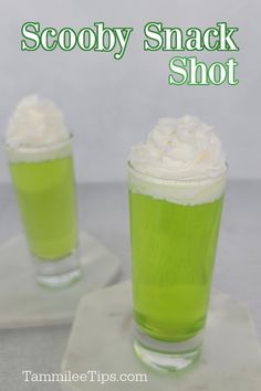 two green drinks with whipped cream on top and the words scoopy snack shot above them