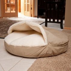 a dog bed on the floor in a living room