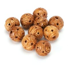 small wooden beads with holes in the middle