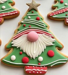 decorated christmas tree cookies on a table