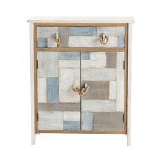 a white and blue cabinet with two doors on the front, one door open to reveal a patchwork design