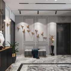 an elegant living room with marble flooring and walls decorated in gold, white and black