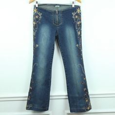 Vintage Y2K Z Cavaricci waistless low rise zip front jeans.  They are a size 9. They have embroidery down the sides of the legs. The pants have been hemmed,  there is about an inch inside that could be let out if you wanted to. Please see all photos for condition and check the measurements for size.  The pants are gently used with no holes/stains or tears. Waist 32" Hip 38" Rise 8" Inseam 29 1/2" Leg Opening 18" C3 Embroidered Stretch Straight Leg Bottoms, Stretch Embroidered Denim Bottoms, Embroidered Stretch Denim Bottoms, Stretch Embroidered Denim Jeans, Stretch Denim Jeans With Embroidery, Fitted Embroidered Flare Jeans With Straight Leg, Embroidered Stretch Straight Leg Jeans, Fitted Embroidered Denim Pants, Fitted Mid-rise Embroidered Flare Jeans