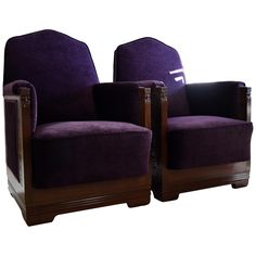 two purple chairs sitting next to each other