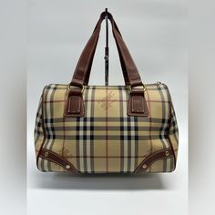 Burberry Coated Canvas Classic Plaid Horse Print Exterior With Brown Leather Handles Black Canvas Interior Gold Hardware (Slightly Tarnished) , Functional Zipper (Missing Zipper Pull), Other Signs Of Wear Due To Being Pre-Owned Are Minor Scuffs, Peeling Interior Leather Burberry Date Code Tag, Scratches, And Other Marks. Please Refer To The Photos For Further Details. 5” Handle Drop Available In Store For $380 Sns8668 Burberry Coat, Gold Interior, Horse Print, Boston Bag, Leather Handles, Black Canvas, Burberry Bag, Tan Brown, Leather Handle