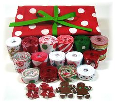 a red bag filled with lots of different types of wrapping paper and gingerbreads