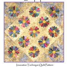 a quilt with many different colored flowers on the front and back side, all in one square