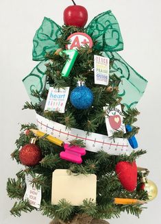 a small christmas tree decorated with school supplies