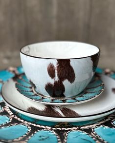 a cup and saucer sitting on top of a plate