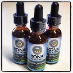 three bottles of kona kava farm tinctures on a white table top