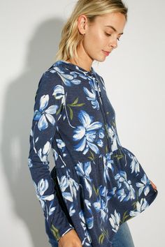 FLORAL PRINT JERSEY BABYDOLL WITH HOODIE CASUAL TOP- Floral print jersey babydoll with hoodie casual top- Long sleeve- Hoodie with self drawstring- Relaxed fit tunic length- Floral print jersey- Model is 5' 8" 31-24-35 and wearing a Small- 87% POLYESTER, 10% RAYON, 3% SPANDEX- MADE IN U.S.A Style: Casual Print / Pattern: Floral print Fit: Relaxed fit Embellishment: Hoodie Sleeve: Long sleeve Lining: No Made In: United StatesFabric Contents: 86% POLYESTER, 10% RAYON, 4% SPANDEXNon-sheer fabricCare Instructions: Machine wash cold, Do not bleachSize Measurement (inch): S: 36.0-38.0 (Bust), null (Waist), null (Hips), null (Length) M: 38.0-40.0 (Bust), null (Waist), null (Hips), null (Length) L: 40.0-42.0 (Bust), null (Waist), null (Hips), null (Length) Casual Spring Hoodie Top, Casual Long Sleeve Tops With Drawstring Hood, Hooded Spring Loungewear Top, Drawstring Hooded Tops For Loungewear, Hooded Drawstring Tops For Loungewear, Blue Long Sleeve Top With Drawstring Hood, Blue Floral Print Top For Winter, Blue Floral Print Tops For Winter, Winter Blue Floral Print Tops