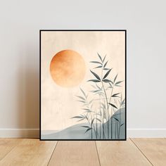 an art print with bamboo leaves and the sun in the background on a wooden floor