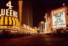 the neon vegas sign is lit up at night