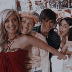 the young people are posing together for a photo in front of christmas decorations and candy canes