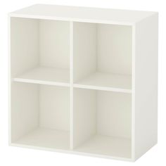 a white cube shelf unit with four sections