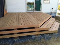 a wooden deck with steps leading up to it