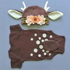 a brown outfit with flowers and antlers on it