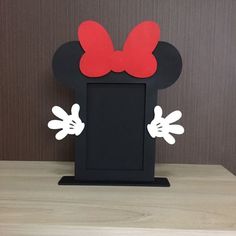 a black and red mickey mouse head with ears