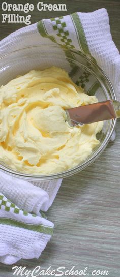 an orange cream filling in a glass bowl