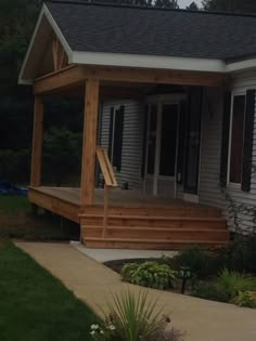 a house with a porch and steps leading to the front door