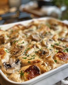 a casserole dish with mushrooms and cheese