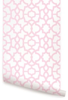 a pink and white wallpaper with an abstract pattern on the bottom half of it