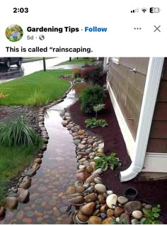 an image of a garden with rocks and water flowing down the side of it in front of a house