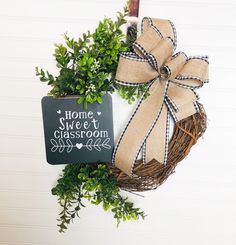 a home sweet classroom wreath with a chalkboard hanging on the front door hanger