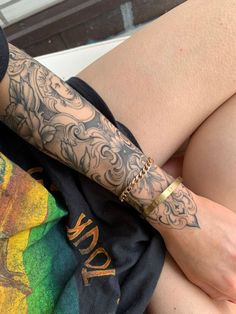 a person with tattoos on their arms and legs