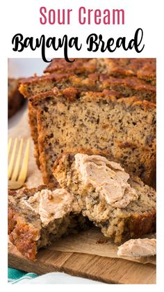 a loaf of banana bread on a cutting board with the words sour cream banana bread