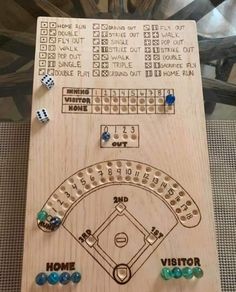 a wooden board with some dices on it and a baseball game in the background