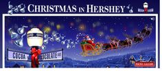 christmas in hershey poster with santa riding his sleigh and reindeers on the street