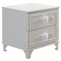 a white nightstand with two drawers sitting on top of it's legs and one drawer open