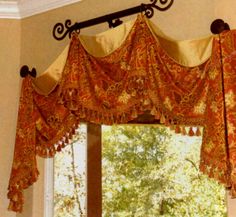 the curtains are hanging on the rod in front of the window with an open curtain valance