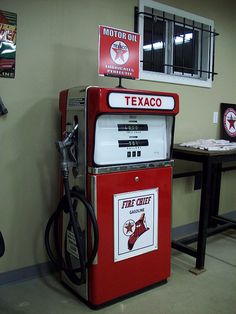 an old texaco gas pump in a garage