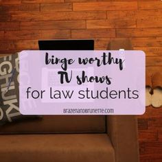 a couch with a laptop on it and the words, large worthy tv shows for law students