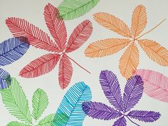 an image of colorful leaves painted on white paper with colored crayon pencils